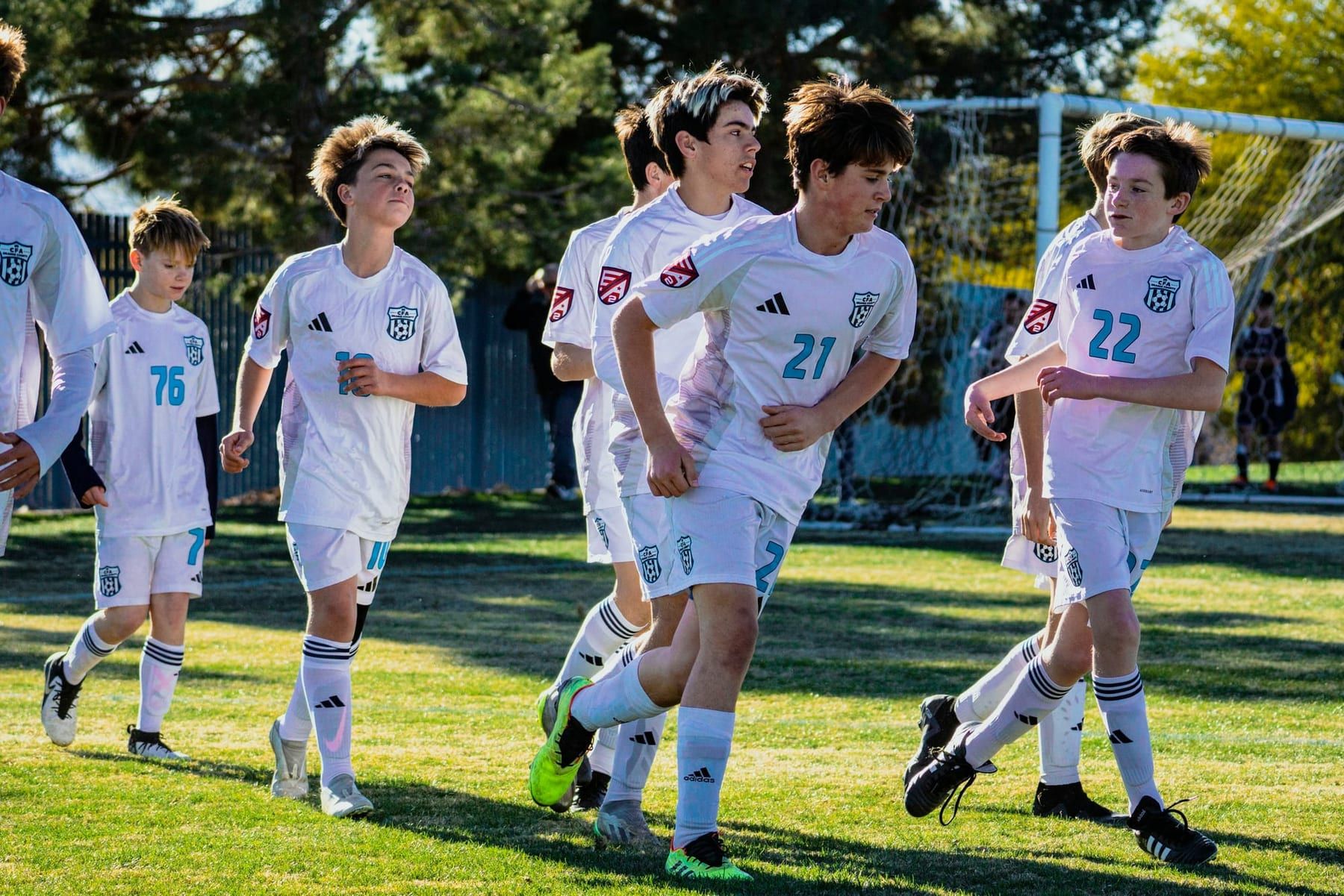 CFA boys in white attacking together during a match